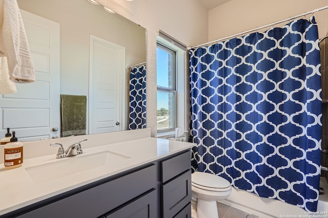 full bathroom with vanity, shower / tub combo with curtain, toilet, and tile patterned floors