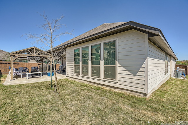 back of house featuring a lawn, a gazebo, and a patio