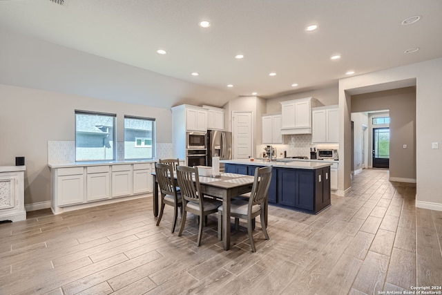 dining space with light wood-type flooring