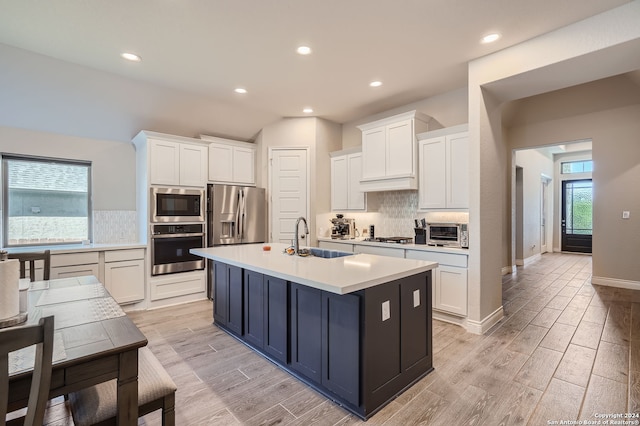 kitchen featuring white cabinetry, appliances with stainless steel finishes, and sink