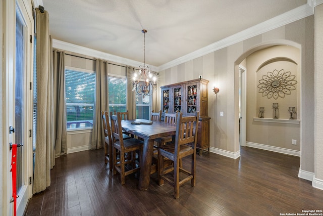 dining space featuring a notable chandelier, dark hardwood / wood-style floors, and crown molding