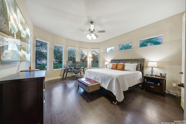 bedroom featuring dark hardwood / wood-style flooring and ceiling fan