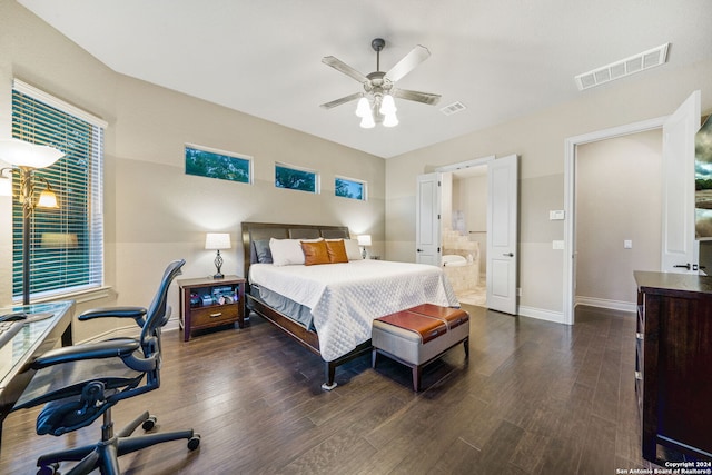 bedroom with ceiling fan, connected bathroom, and dark hardwood / wood-style flooring