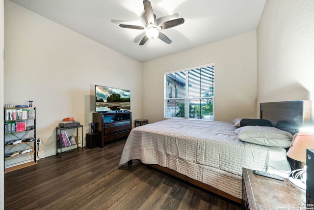 bedroom with ceiling fan and dark hardwood / wood-style flooring