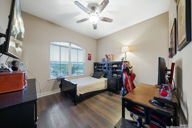 bedroom featuring ceiling fan and dark hardwood / wood-style floors