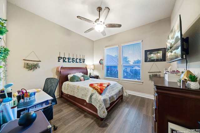 bedroom featuring ceiling fan and dark hardwood / wood-style floors