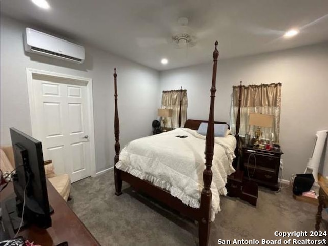 carpeted bedroom featuring an AC wall unit and ceiling fan