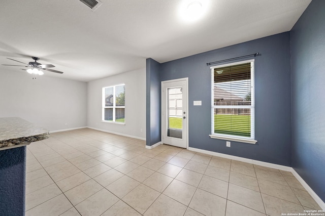 interior space featuring ceiling fan