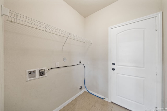 laundry area with light tile patterned floors, hookup for a gas dryer, electric dryer hookup, and washer hookup