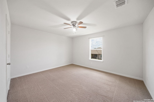 spare room with carpet floors and ceiling fan