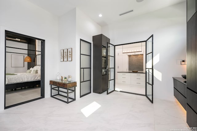 bedroom featuring a high ceiling