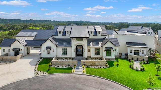 modern inspired farmhouse with a front yard