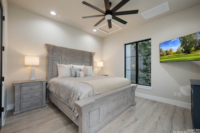 bedroom featuring light hardwood / wood-style flooring and ceiling fan