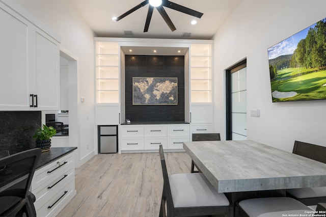 dining area featuring light wood-type flooring and ceiling fan