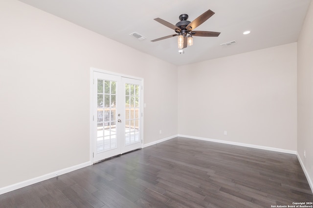 empty room with dark wood-type flooring, french doors, and ceiling fan