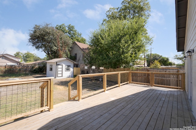 wooden terrace with a storage unit