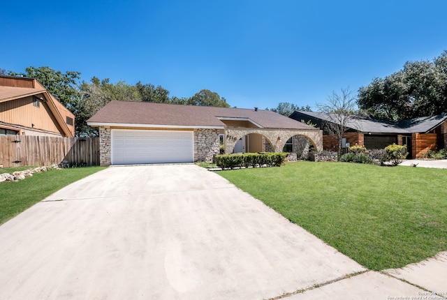 ranch-style house with a front yard and a garage