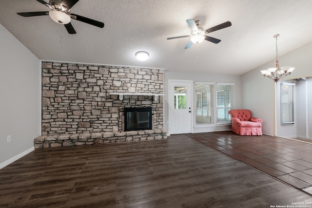 unfurnished living room with a textured ceiling, lofted ceiling, and dark hardwood / wood-style flooring