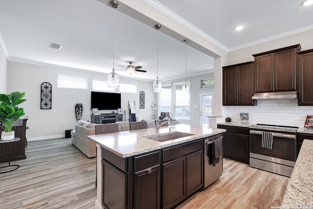 kitchen featuring sink, hanging light fixtures, light hardwood / wood-style flooring, stainless steel appliances, and ceiling fan