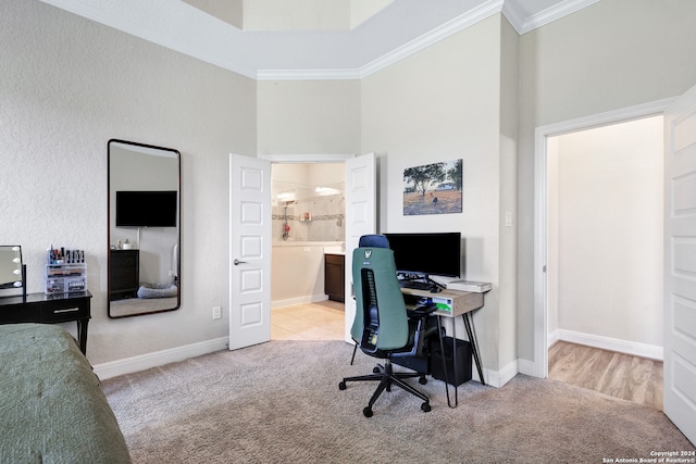 carpeted home office with crown molding and a high ceiling