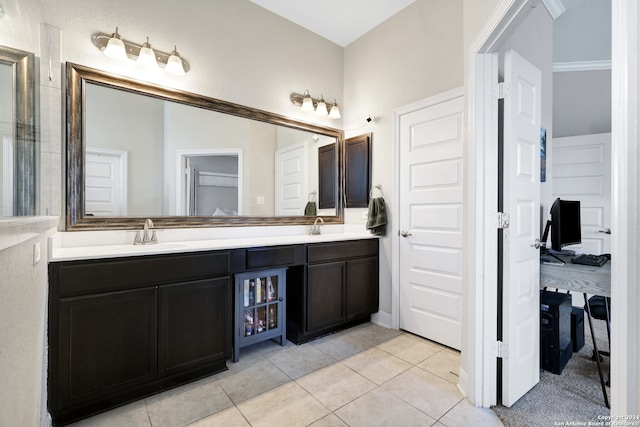 bathroom with tile patterned flooring and vanity