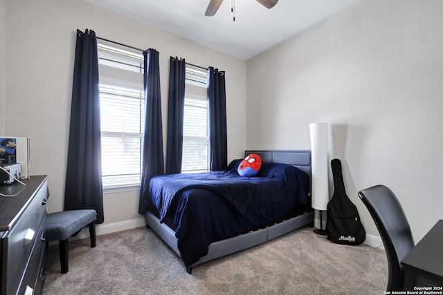 carpeted bedroom with ceiling fan