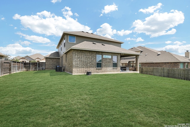 back of property featuring a patio, a yard, and central air condition unit