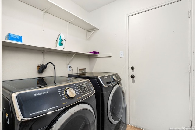 washroom with washer and dryer