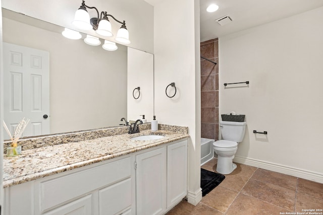 full bathroom with vanity, toilet, and tiled shower / bath