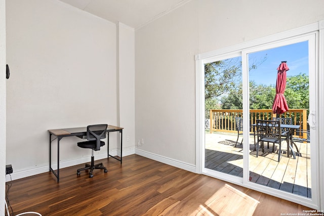 office area featuring crown molding and dark hardwood / wood-style flooring