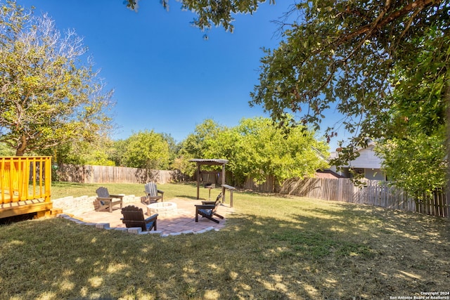 view of yard with a patio and a fire pit