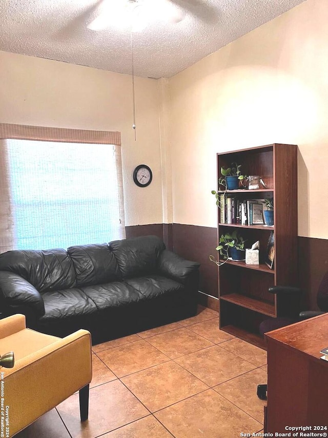 tiled living room with a textured ceiling