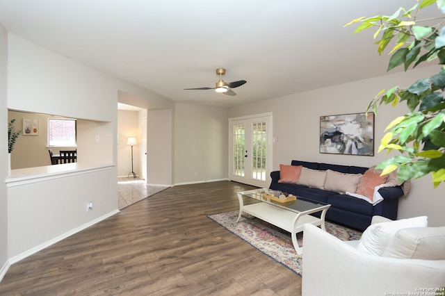 living room featuring dark hardwood / wood-style floors, ceiling fan, and french doors