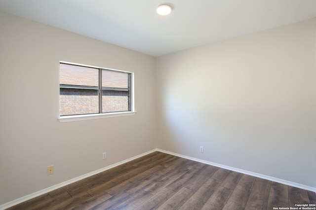 unfurnished room featuring dark hardwood / wood-style floors