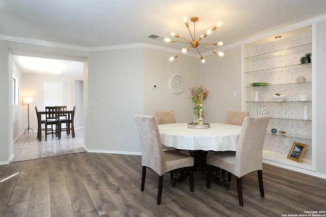 dining room featuring crown molding, built in shelves, dark hardwood / wood-style flooring, and a notable chandelier