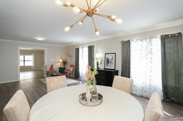 dining room featuring ornamental molding, a notable chandelier, and dark hardwood / wood-style floors