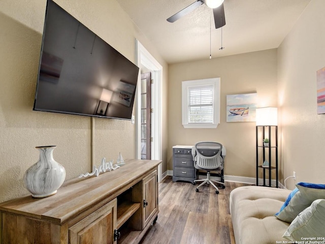 office area with ceiling fan and light hardwood / wood-style floors