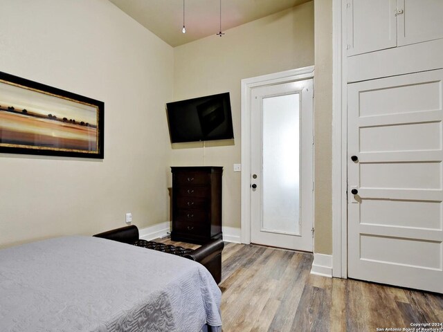 bedroom with hardwood / wood-style flooring