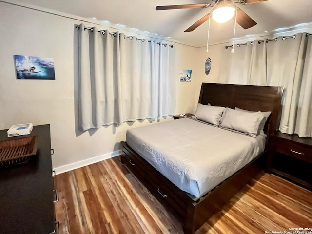 bedroom with ceiling fan and hardwood / wood-style floors