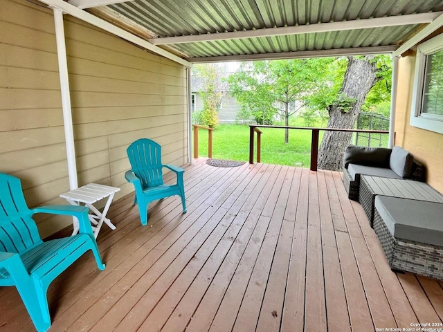 deck featuring a lawn