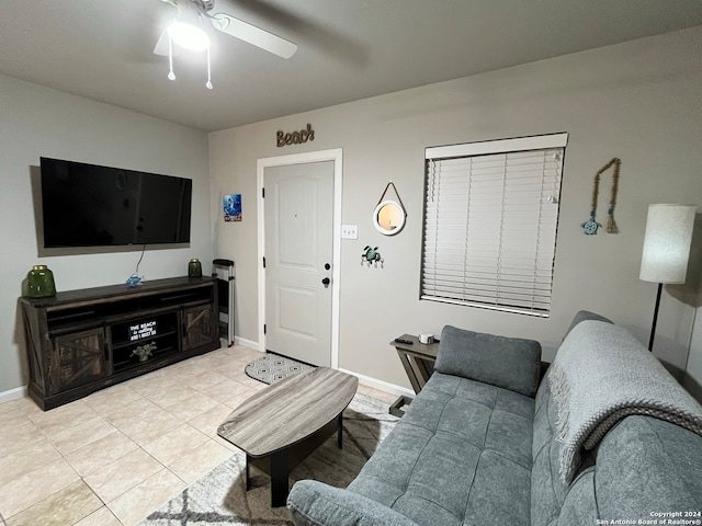 tiled living room with ceiling fan