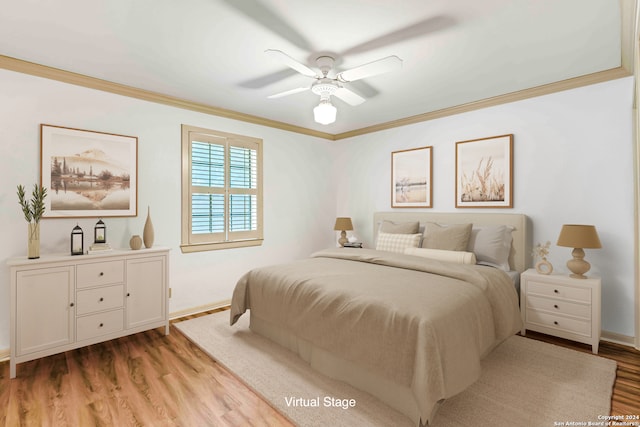 bedroom with light hardwood / wood-style floors, ceiling fan, and crown molding