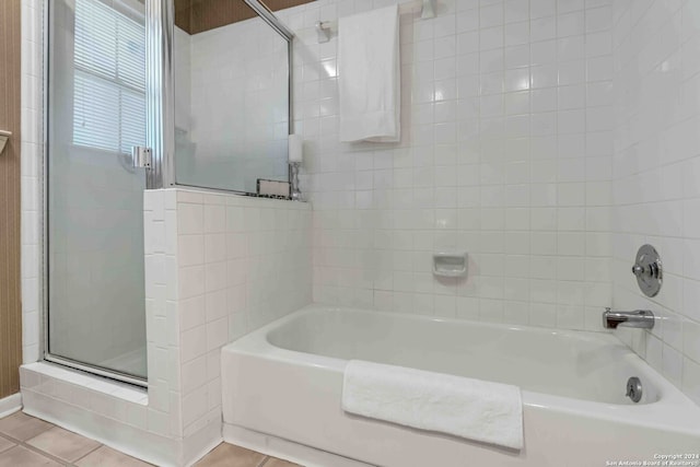 bathroom featuring shower with separate bathtub and tile patterned floors