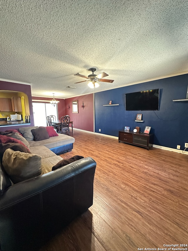 living room with a textured ceiling, wood-type flooring, and ceiling fan with notable chandelier