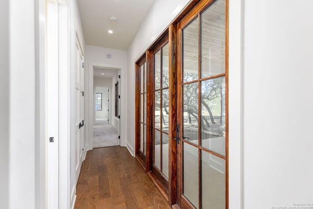 hall featuring dark wood-style flooring, french doors, recessed lighting, and baseboards