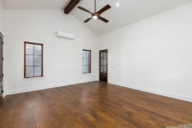 empty room featuring beamed ceiling, ceiling fan, an AC wall unit, dark wood-type flooring, and high vaulted ceiling