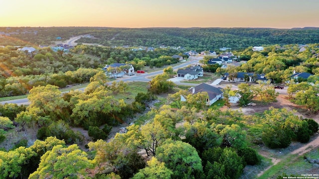 aerial view featuring a residential view and a forest view