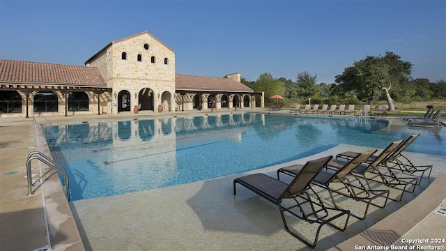 pool with a patio area