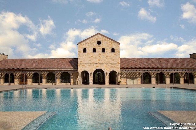 view of pool featuring a patio