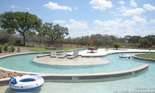 view of swimming pool featuring a patio